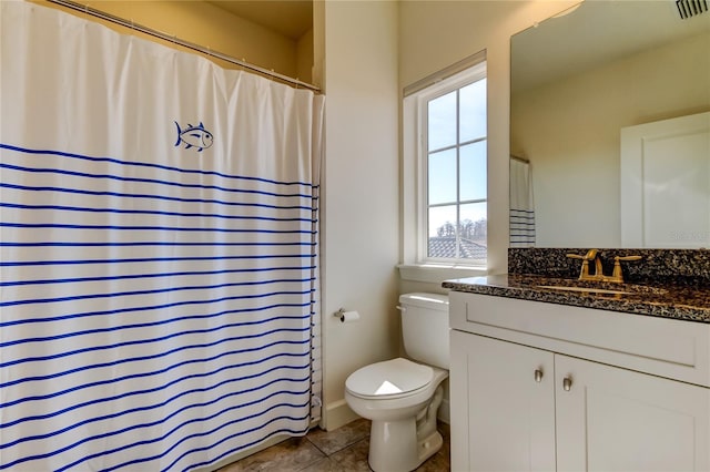 full bathroom with tile patterned flooring, visible vents, vanity, and toilet