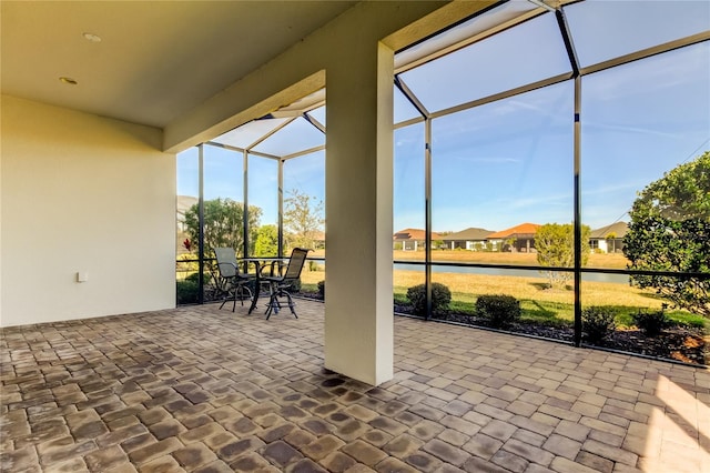 view of patio / terrace with glass enclosure and outdoor dining area