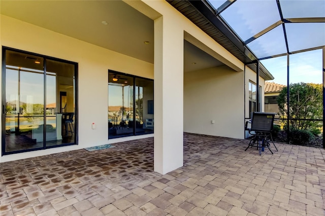 view of patio with a lanai