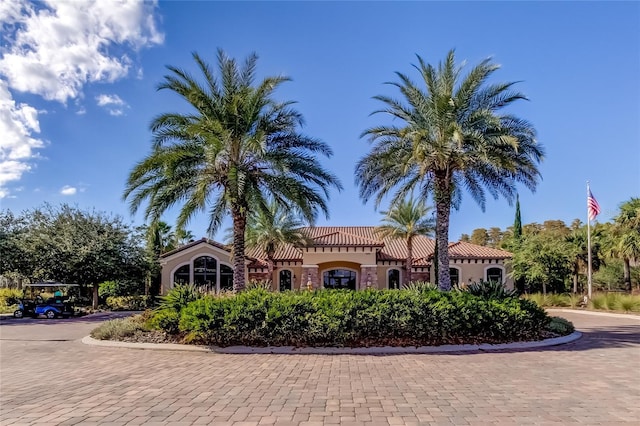 view of front of property featuring a tile roof and stucco siding