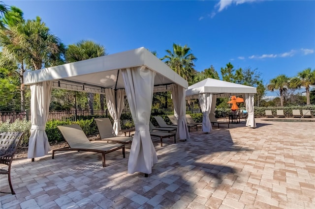 view of patio / terrace featuring fence and a gazebo