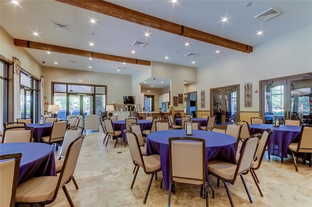 dining area featuring french doors, beam ceiling, and visible vents