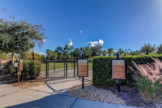 view of gate with fence