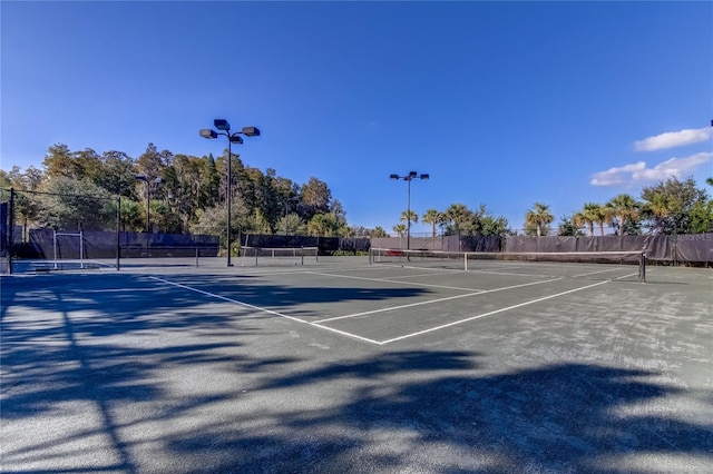 view of sport court with fence