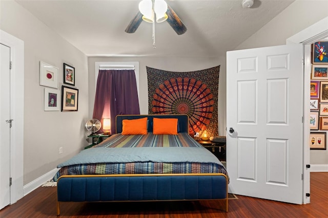 bedroom featuring ceiling fan, baseboards, and wood finished floors