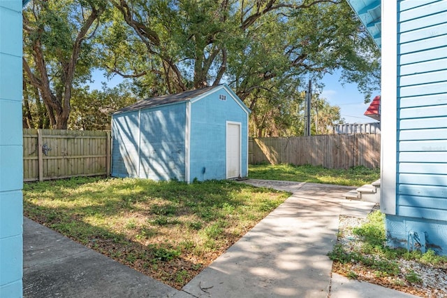 view of shed with a fenced backyard