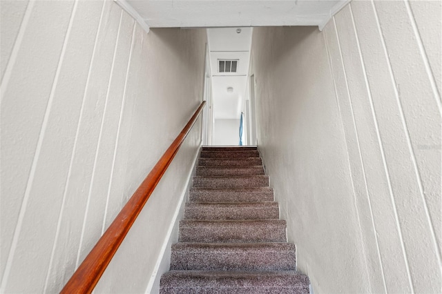 staircase featuring visible vents