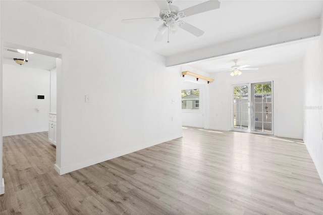 spare room with light wood-style flooring, baseboards, and ceiling fan