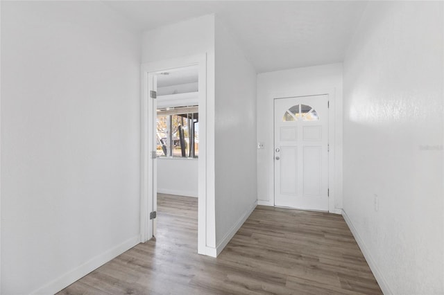 interior space with wood finished floors and baseboards