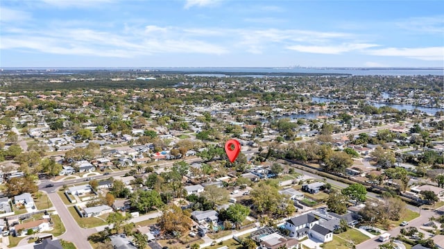 birds eye view of property with a residential view and a water view