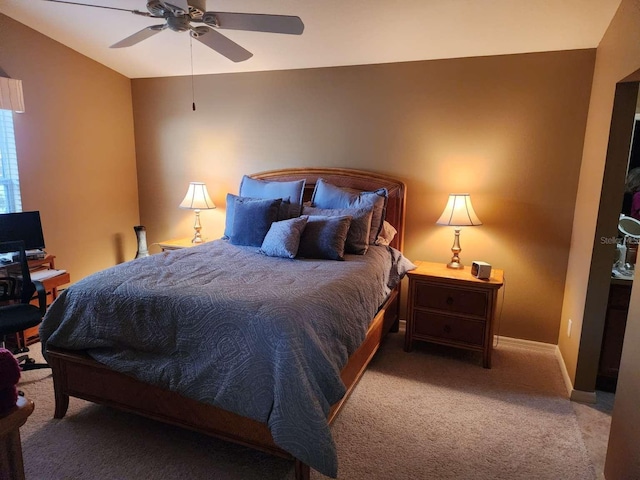 bedroom with a ceiling fan, carpet, and baseboards