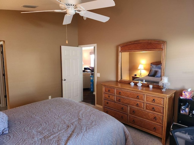 bedroom featuring a ceiling fan, visible vents, and carpet flooring