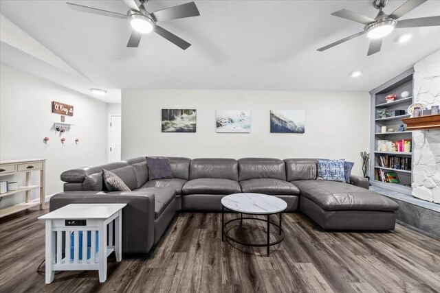 living area featuring built in features, a ceiling fan, and wood finished floors