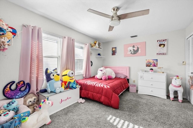 bedroom featuring visible vents, carpet, a closet, and ceiling fan