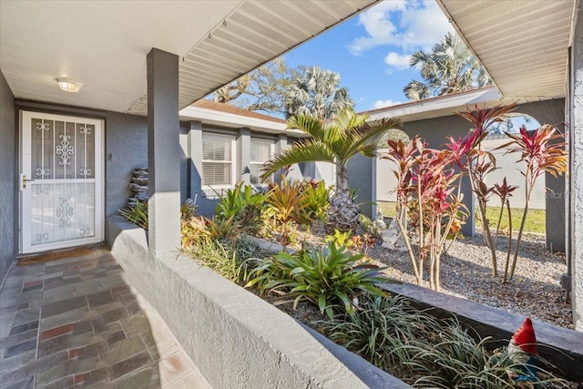 property entrance featuring stucco siding