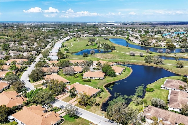 birds eye view of property featuring a water view and a residential view