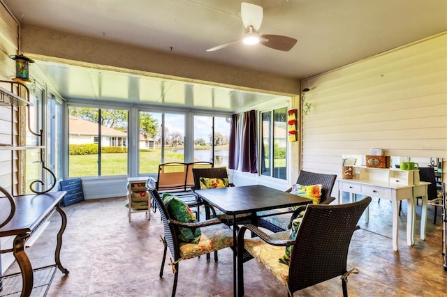 sunroom with a ceiling fan