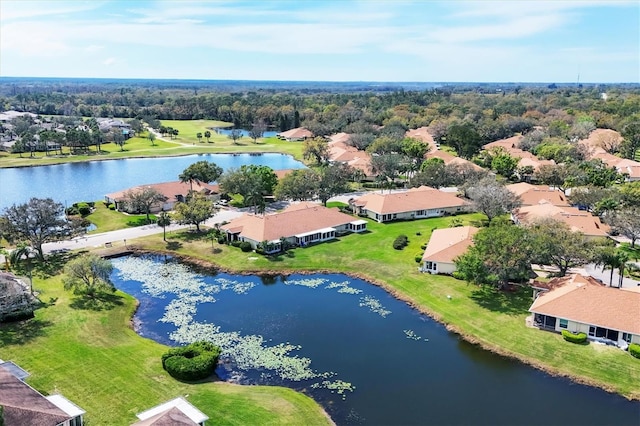 drone / aerial view featuring a residential view and a water view