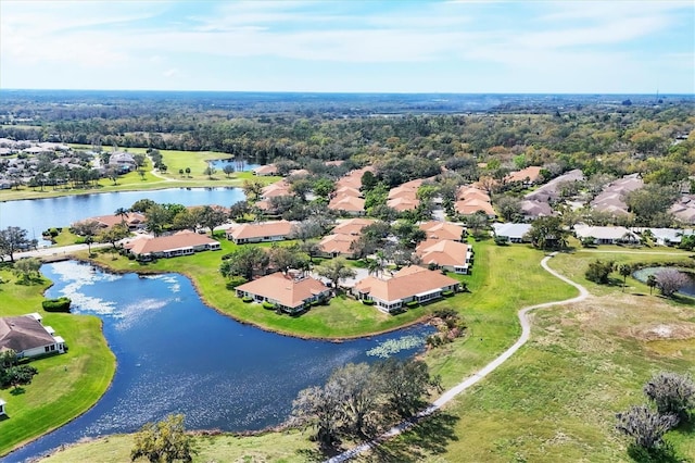 drone / aerial view with a residential view and a water view