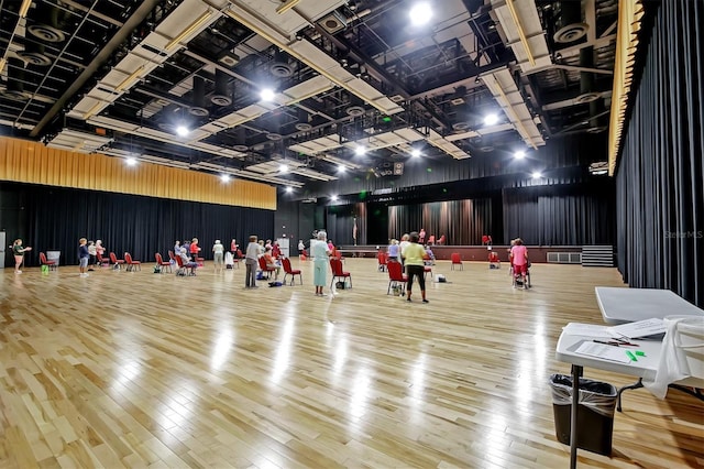 misc room featuring visible vents, metal wall, and hardwood / wood-style flooring