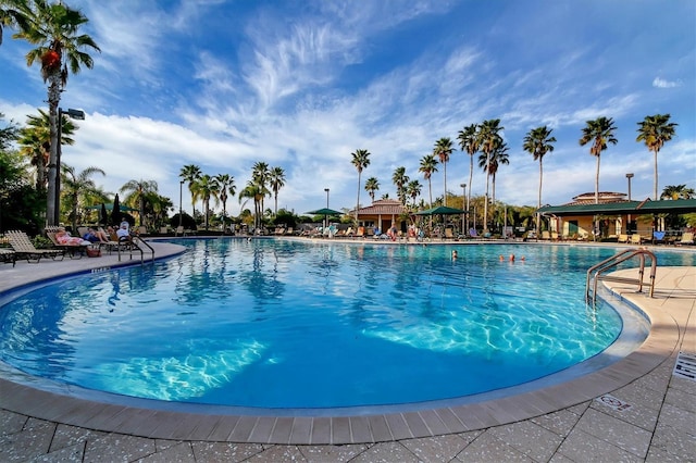 community pool with a patio area