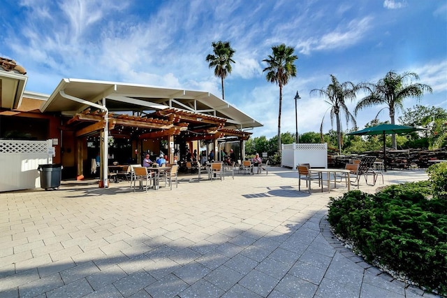 view of home's community featuring a patio area and fence