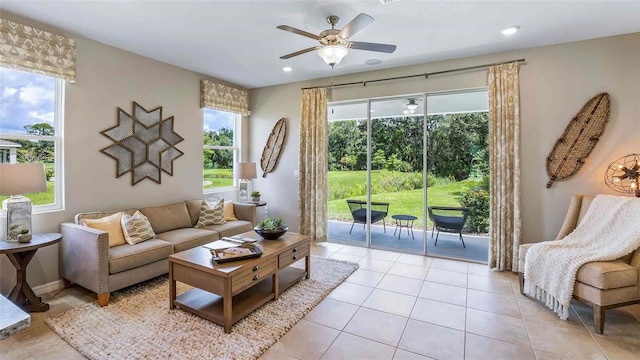 living area featuring a ceiling fan, recessed lighting, and light tile patterned floors