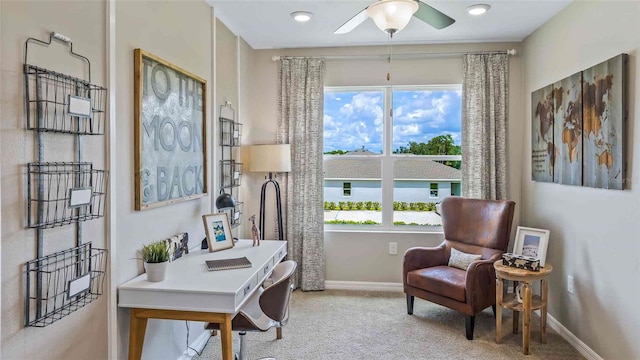 office with light carpet, ceiling fan, and baseboards