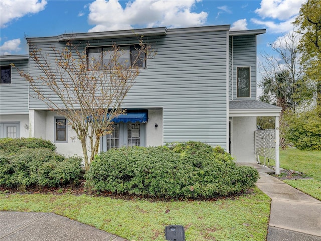 view of front of property featuring a front yard and stucco siding