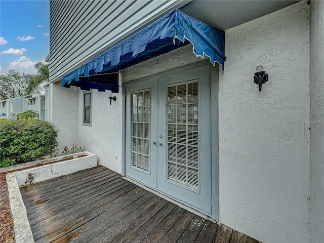 wooden deck featuring french doors