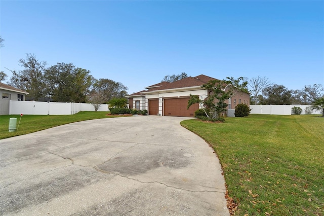 view of property exterior featuring stucco siding, concrete driveway, a lawn, an attached garage, and fence