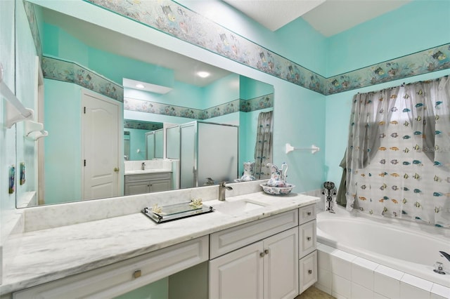 full bath with a stall shower, a garden tub, and vanity