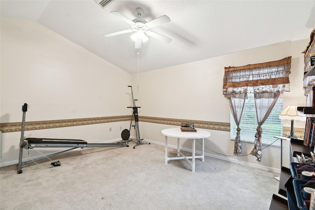 workout area featuring lofted ceiling, baseboards, ceiling fan, and carpet