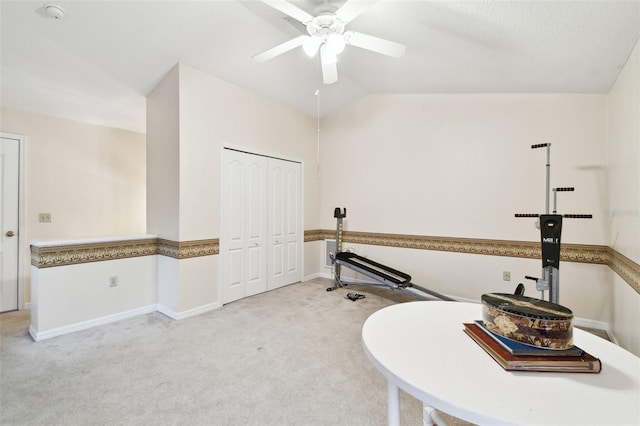 bathroom with ceiling fan, baseboards, and vaulted ceiling