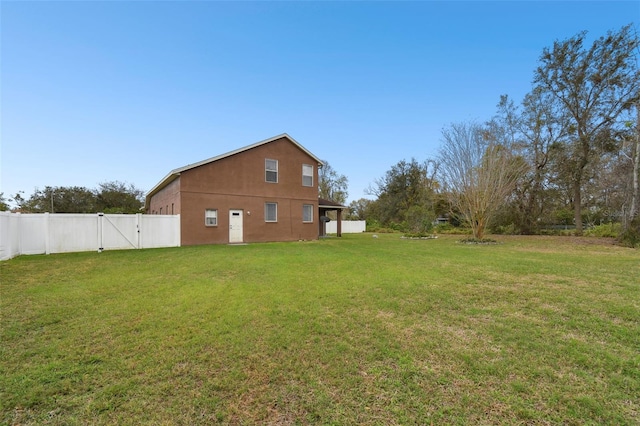 view of yard with a gate and fence