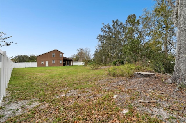 view of yard with a fenced backyard