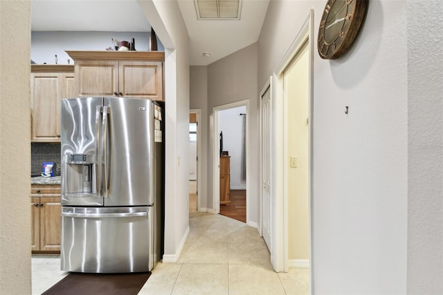 3613 Pendleton Way, Land O Lakes, FL 34639 - kitchen with stainless steel refrigerator with ice dispenser, light tile patterned floors, decorative backsplash, and light brown cabinets