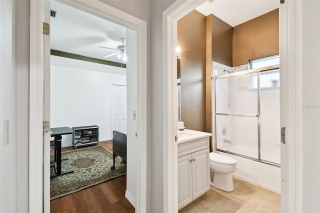 3613 Pendleton Way, Land O Lakes, FL 34639 - full bathroom with ceiling fan, vanity, enclosed tub / shower combo, and heating unit