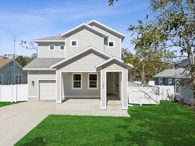 view of front of property featuring a shingled roof, a front yard, concrete driveway, and fence