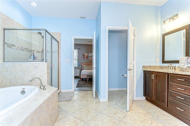 full bathroom featuring visible vents, a stall shower, vanity, tile patterned flooring, and a bath