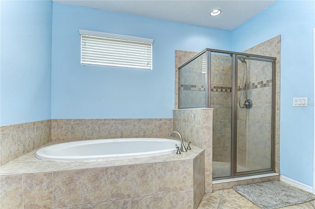 bathroom with a stall shower, tile patterned flooring, a bath, and recessed lighting