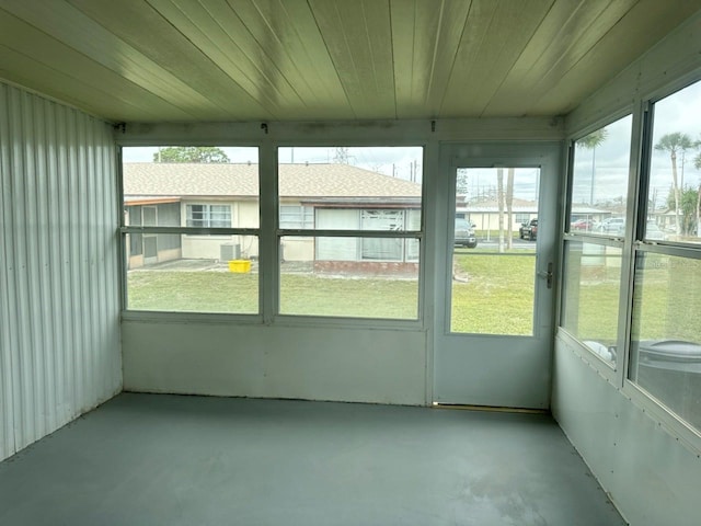 unfurnished sunroom featuring a wealth of natural light