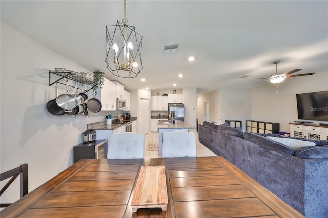 dining area with ceiling fan with notable chandelier, visible vents, and recessed lighting