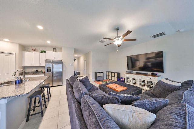 living room with recessed lighting, visible vents, ceiling fan, and light tile patterned flooring