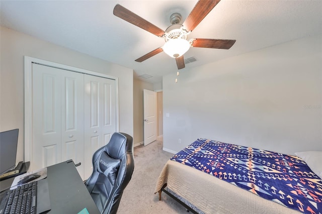 bedroom with light carpet, baseboards, visible vents, ceiling fan, and a closet