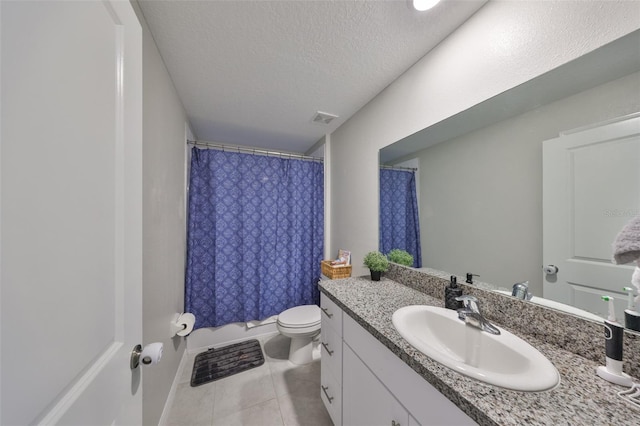 full bath featuring visible vents, toilet, tile patterned flooring, a textured ceiling, and vanity