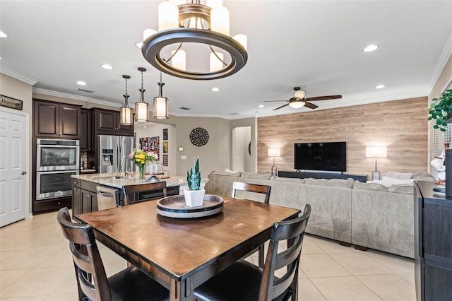 dining area with recessed lighting, an accent wall, crown molding, and light tile patterned flooring