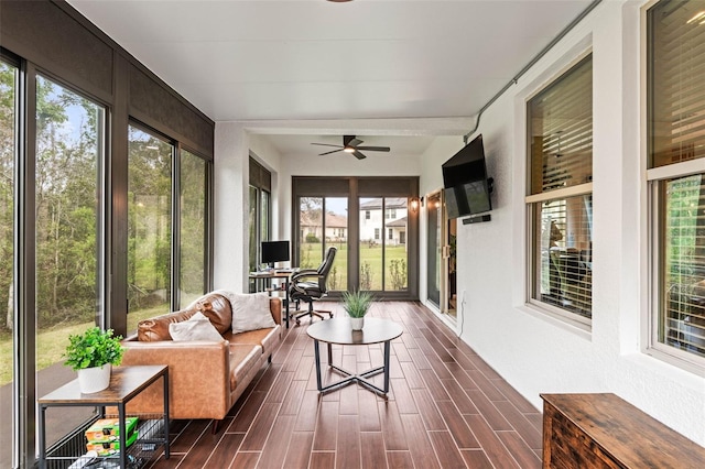 sunroom featuring ceiling fan