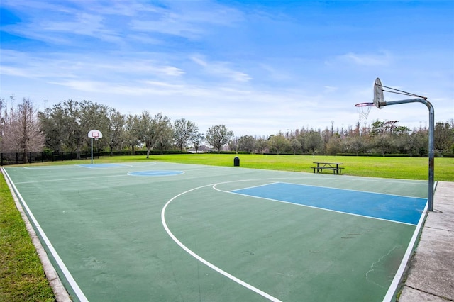 view of sport court with community basketball court and a lawn