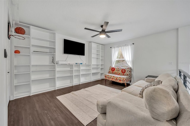 living room with dark wood-style floors and ceiling fan